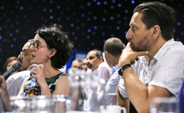 Delegate asking a question at a conference