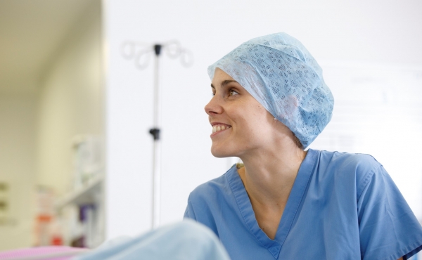 An anaesthetist smiling in theatre