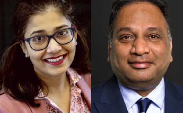 Dr Ashwini Keshkamat is pictured next to Dr Sunil Kumar. Both are wearing business professional clothing and are smiling at the camera.