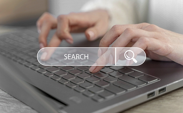 A person searching the web with a keyboard